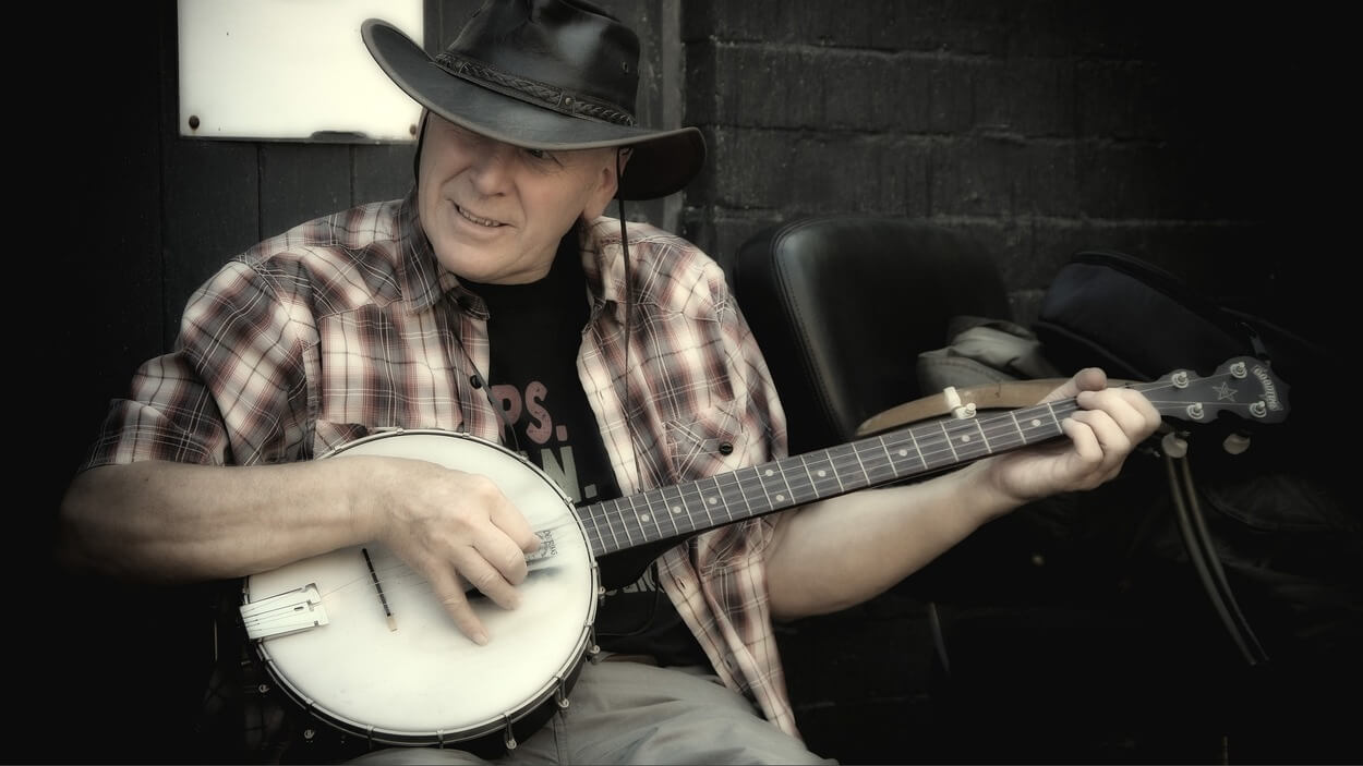 An artist playing banjo