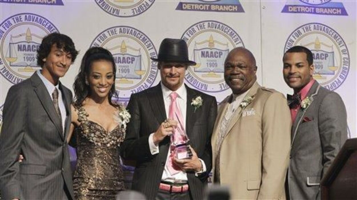 Kid Rock accepts the NAACP award in Detroit.