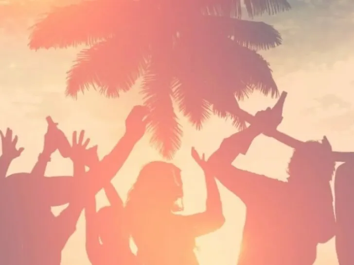A yellow and orange picture of people dancing and a palm tree