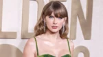 Taylor Swift wears a custom Gucci dress as she arrives at an event.