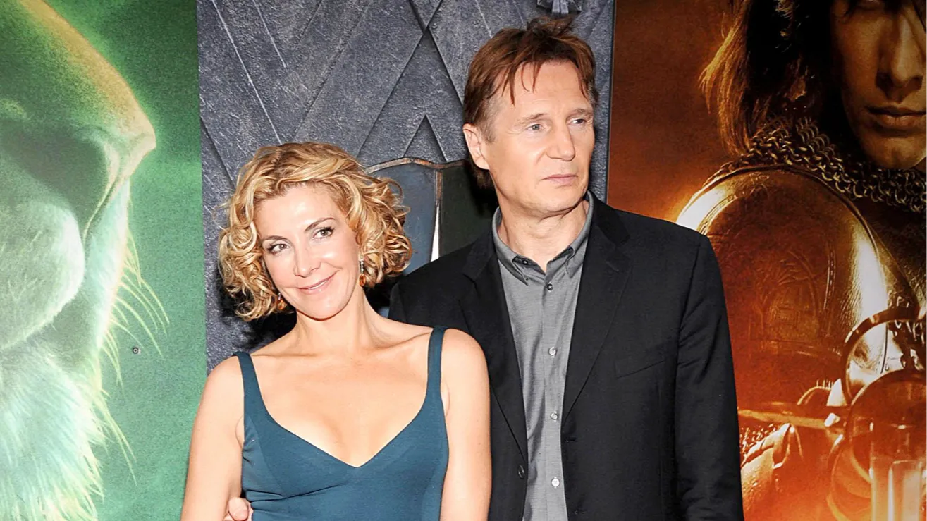 Natasha Richardson and Liam Neeson posing together at an event.
