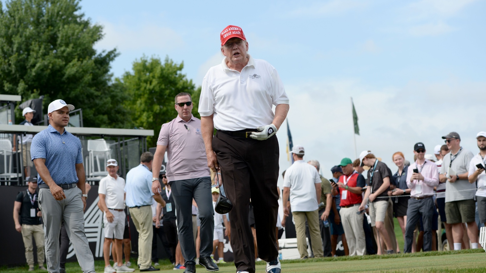 Former President Trump walks off the first Tee during the LIV Pro-Am held at the Trump National Golf Club in Bedminster,NJ.